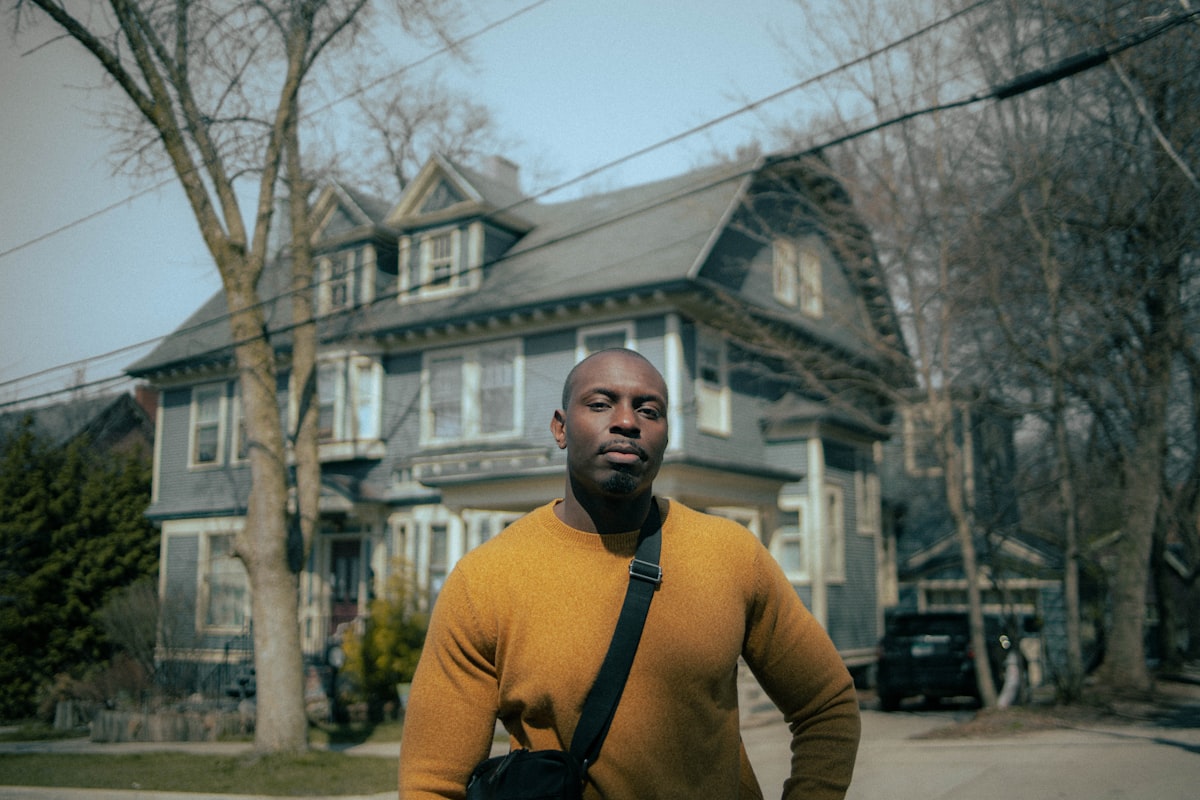 Man walking through a residential neighborhood, representing auto accident victims navigating recovery